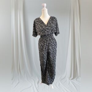 Small black cream floral Japna boutique jumpsuit romper smocked boho v neck